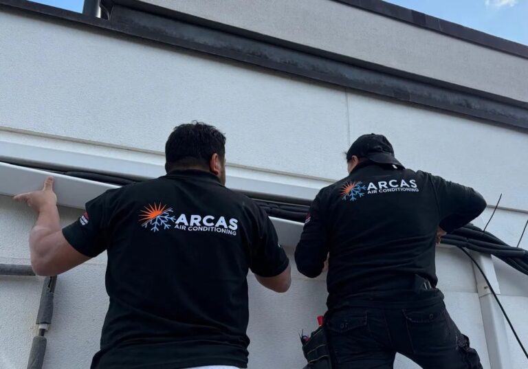 Arcas Team installing Air Conditioning unit