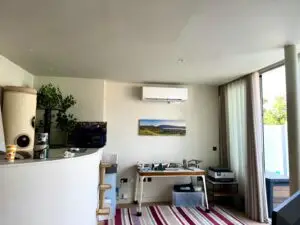 Wall‑mounted air conditioning unit installed in Richmond lounge
