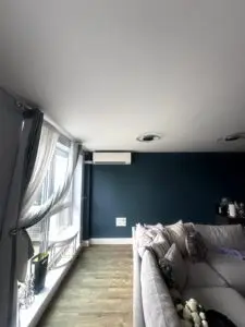 Wall‑mounted air conditioning unit installed in twickenham lounge
