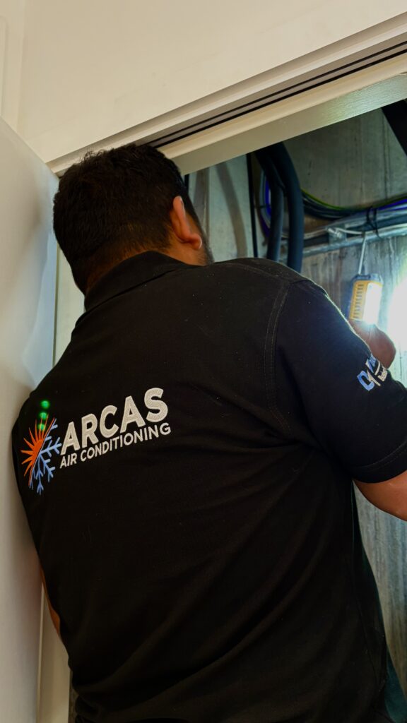Arcas Air Conditioning engineer completing an air conditioning installation in London