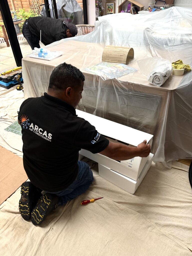 Arcas engineer setting up an air conditioning installation in London