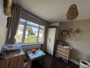 Wall-mounted air conditioning unit in a Camden bedroom