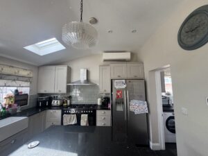 Wall-mounted air conditioning unit above the cabinets in a Greenwich kitchen