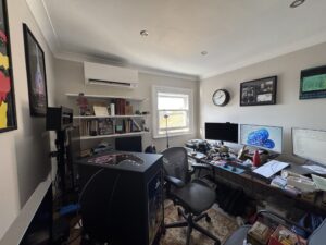 Wall-mounted air conditioning unit in a Teddington home office