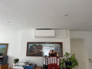 Wall-mounted air conditioning unit with neat trunking in a Teddington office