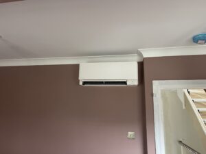 Close-up of a Daikin wall-mounted air conditioning unit installed in Kensington